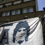 Supporters of Argentine former football star and coach of Gimnasia y Esgrima La Plata Diego Maradona, remain outside the Ipensa clinic where Maradona has been admitted, in La Plata, Buenos Aires province, on November 3, 2020. - Argentine football great Diego Maradona was admitted to hospital Monday for medical checks, his personal doctor announced. (Photo by JUAN MABROMATA / AFP)